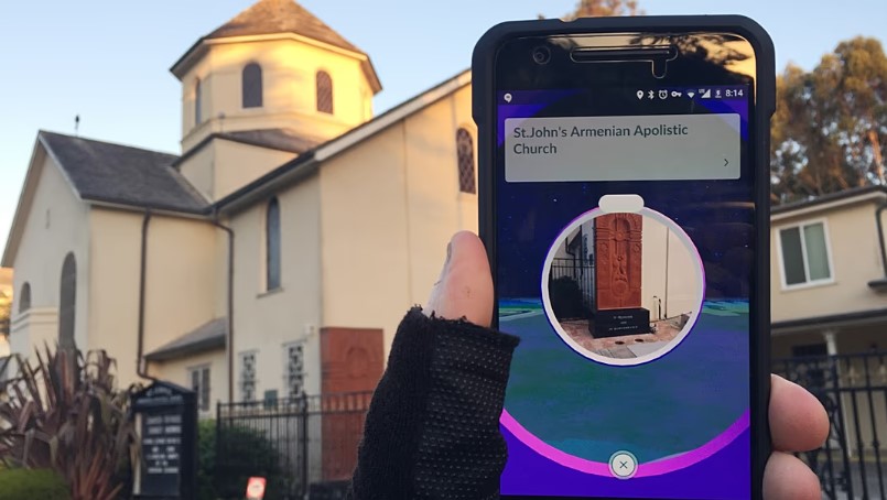 Pokemon Go on a smartphone in front of a church, in San Francisco (AP Photo/David Hamilton)