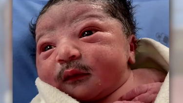 Is video of baby born with mustache real or fake?